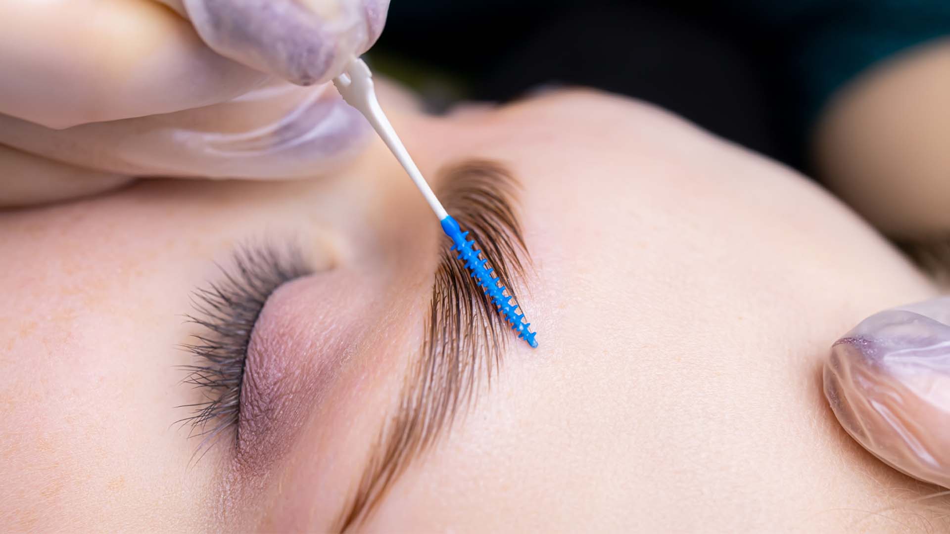 image of a guest receiving waxing and brow services