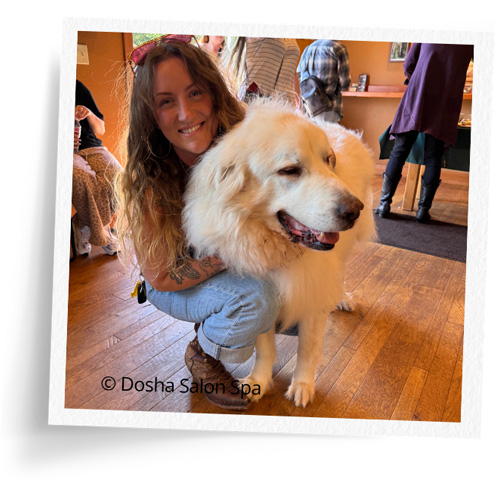 Dosha team member Master stylist Hannah with her dog at Hopkins