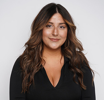 Dosha Salon Spa guest showcasing dimensional hair color with natural depth, contrast, and shine.