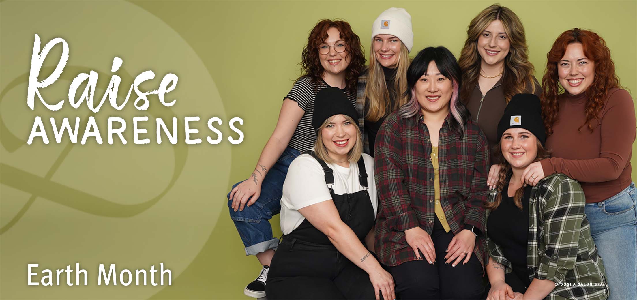 Image of dosha employees in a group photo celebrating earth month