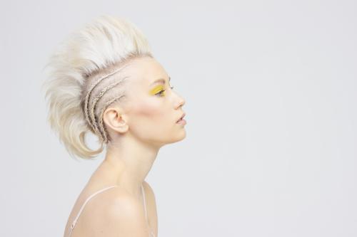 Hair and Makeup by Dosha Creative Team updo blonde mohawk fauxhawk braid cornrow yellow makeup