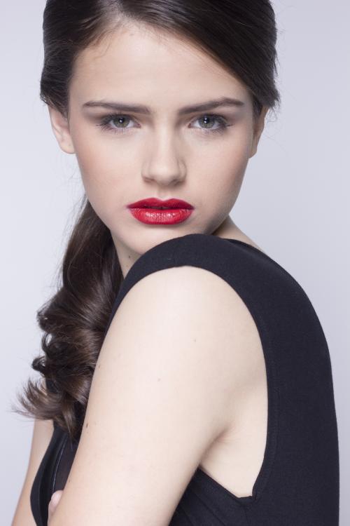 ponytail close up updo elegant street style curls black top edgy red lipstick