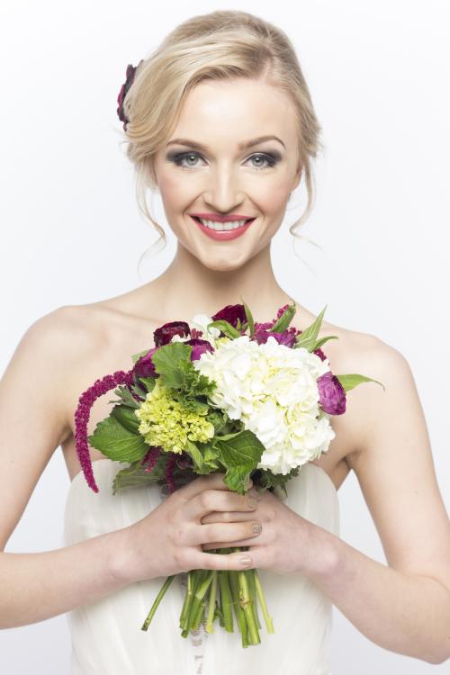 bridal bride wedding updo hair hairstyle flower bouquet