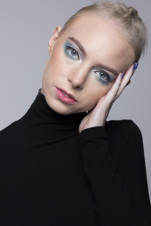 by Dosha Creative Team blonde french braid dutch braid blue eye shadow peach lip blend makeup