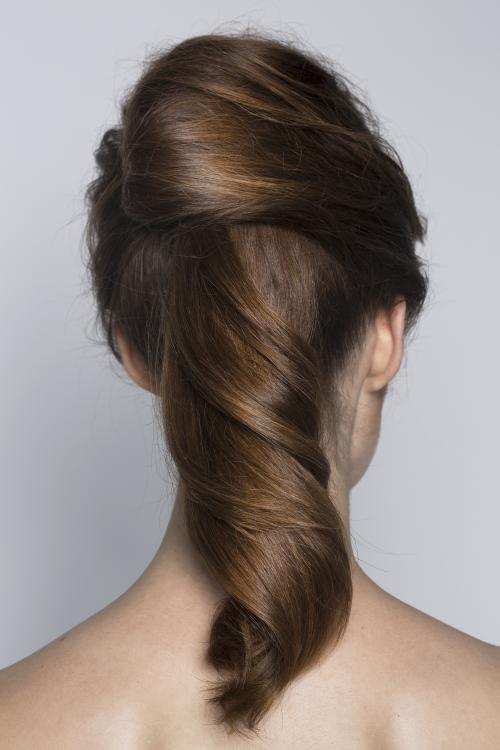 sleek curly updo chignon brunette wavy smooth ponytail pony date night hair style dosha aveda dosha creative team