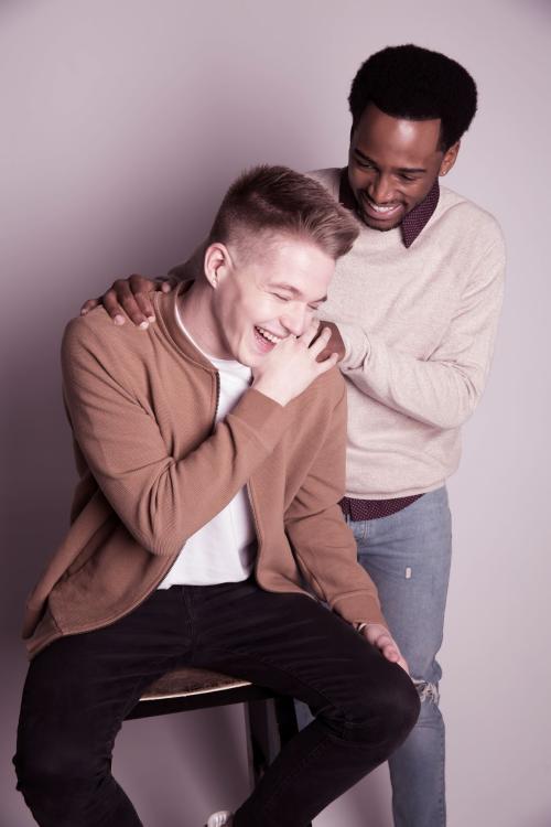 Male models with hairstyles posing and laughing in a Valentines day photoshoot